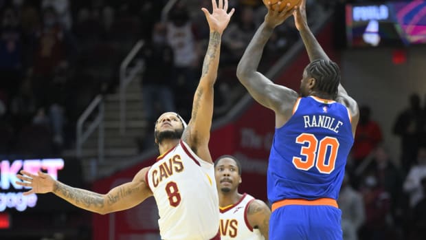 Jan 24, 2022; Cleveland, Ohio, USA; New York Knicks forward Julius Randle (30) takes a last-second shot beside Cleveland Cavaliers forward Lamar Stevens (8) in the fourth quarter at Rocket Mortgage FieldHouse. Mandatory Credit: David Richard-USA TODAY Sports